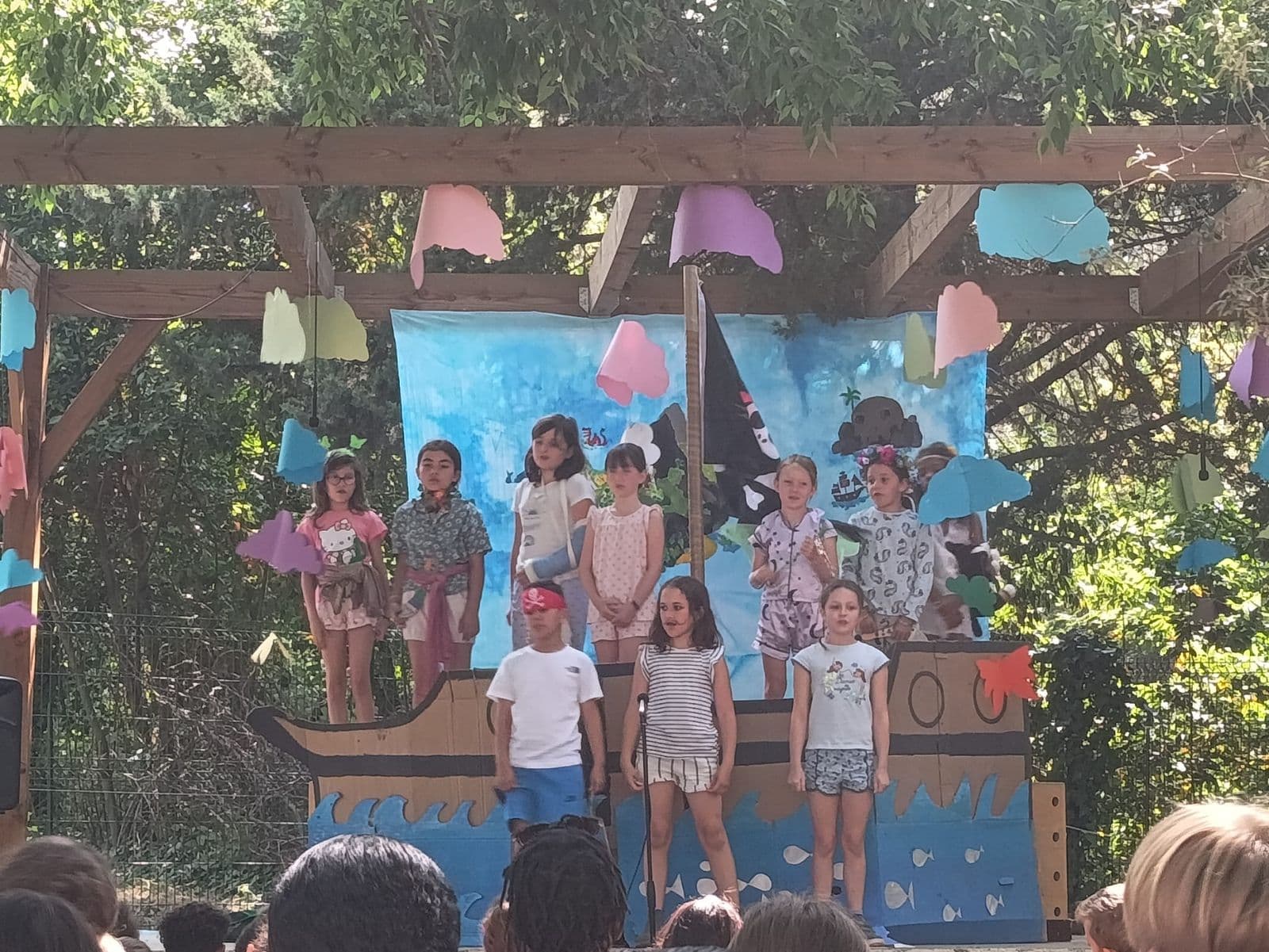 End-of-year show on the outdoor stage, with a ship set.